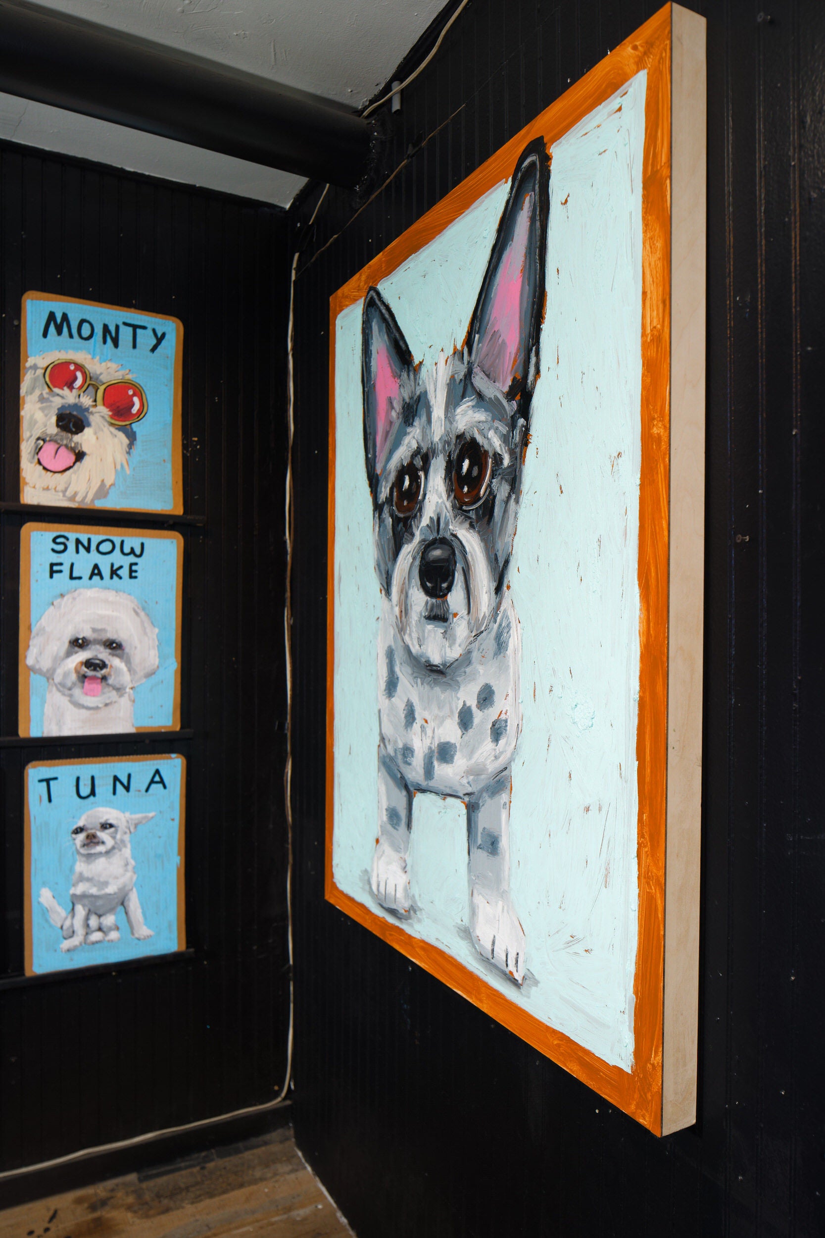 A framed black-and-white Chihuahua portrait by Ben Lenovitz in the studio